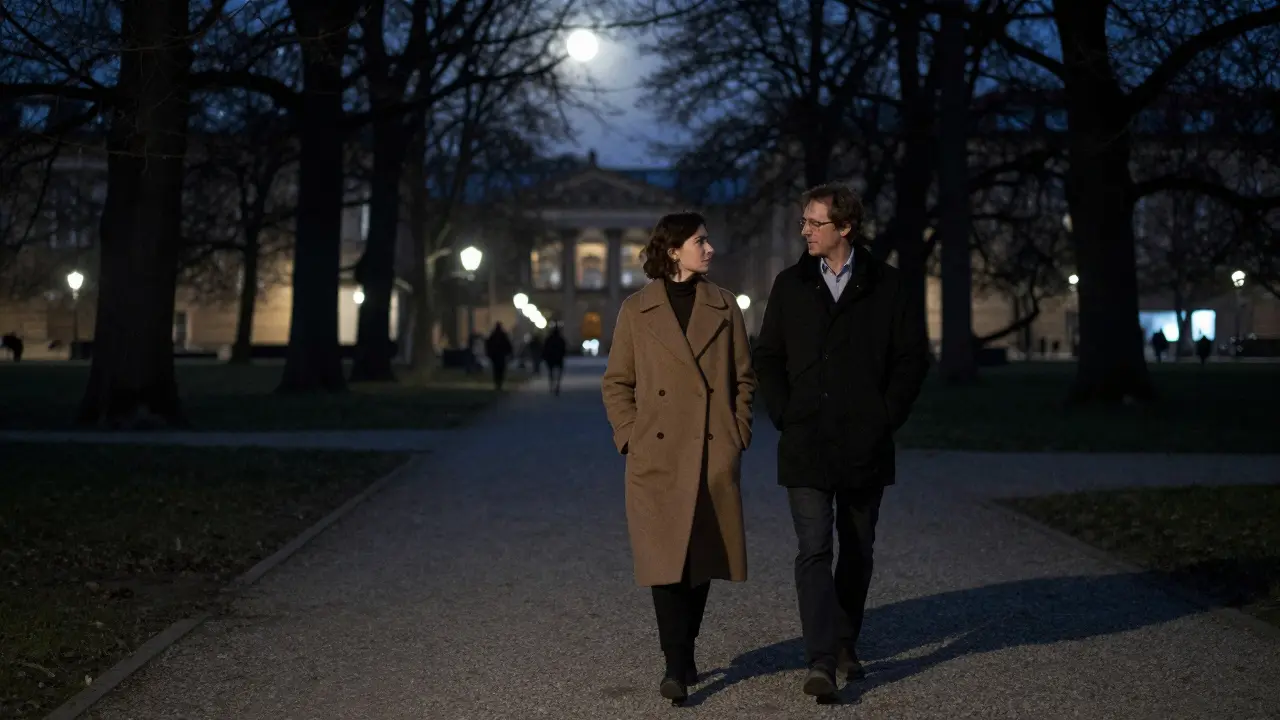 A man and woman walk silently through Tiergarten Park at night, moonlight filtering through trees.
